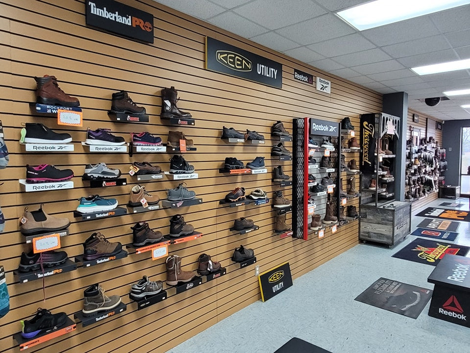 Product wall of footwear inside of Posey County Workwear in Mount Vernon, IN