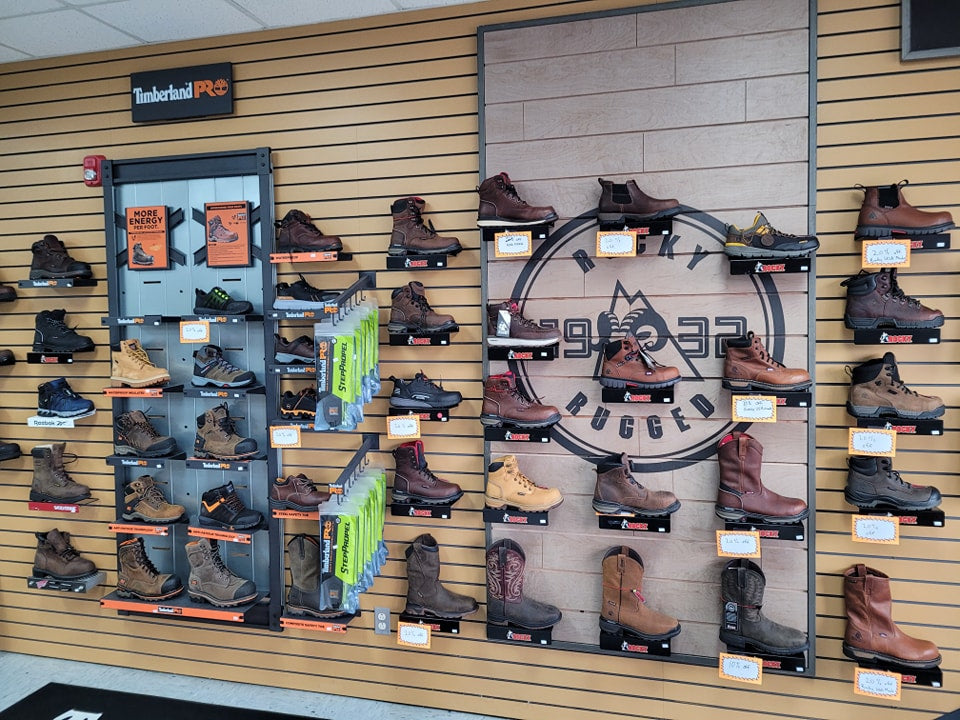 Product wall of footwear inside of Posey County Workwear in Mount Vernon, IN